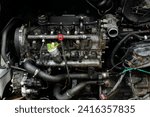 Small photo of Open hood of a truck. Disassembled engine. Disassembled car. Car engine room under maintenance. Car service station. Car repair.
