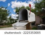 Small photo of Open mailbox in the yard of a house Cobweb inside mailbox