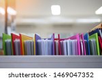 Stack or cabinet of document files in the office, business, finance, or education concept picture of pile of colorful files of papers in the business firm or company
