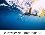 Young Woman Swim Underwater...