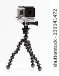 Small photo of ZAGREB, CROATIA - NOVEMBER 6, 2014: Closeup of GoPro Hero 3+ camera on GorillaPod tripod on white background.