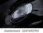 Small photo of United Kingdom, Manchester January 2023.The Front Xenon LED Headlight On A 2022 Porsche 911 Turbo S 992 With Porsche Logo LED Matrix System Inside The Headlight.