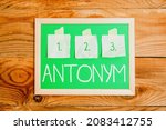 Small photo of Handwriting text Antonym. Internet Concept word or phrase whose meaning is the opposite of another word Display of Different Color Sticker Notes Arranged On flatlay Lay Background