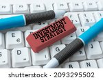 Small photo of Sign displaying Investment Strategy. Business overview Set of Rules Procedures Behavior a Guide to an Investor Editing New Story Title, Typing Online Presentation Prompter Notes