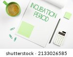 Small photo of Text sign showing Incubation Period. Concept meaning time elapsed starting from getting exposed to an infectious agent Multiple Assorted Collection Office Stationery Photo Placed Over Table