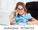 Young beautiful girl speaking phone at working place in office.