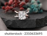 Small photo of Diamond engagement ring isolated on black stone, Diamond ring for girls