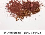 Small photo of This is a photograph of a Burgundy,Metallic Bronze,and Burnt Umber Powder Eyeshadow isolated on a White Background