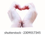Small photo of Kids' hands making a heart shape isolated on white background. A symbol of love and tender bonding of children. classic symbol of love romance, talk about infatuation or may refer to friendship.