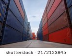container yards with wide angle photo. logistic cargo freight ship for import export container yard with blue sky background.