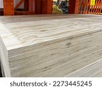 Pile of 23-32 (18mm) 4x8 Radiata Pine Plywood sheets on the shelf in a store. 