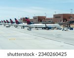 Small photo of Delta Air Lines planes parked at Salt Lake City International Airport in Salt Lake City, Utah, United States - May 11, 2023. Delta Air Lines is an airline of the United States and a legacy carrier.