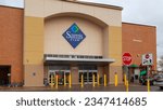 Small photo of Saint Louis, MO, USA - March 24, 2022: The entrance to a Sam’s club store in Saint Louis, MO, USA. Sam's West, Inc. is an American chain of membership-only retail warehouse clubs.