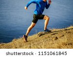 man runner dynamic running on steep slope of mountain