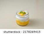 Creamy Mango Sago Dessert, is a sweet dessert from Hong Kong. Made by puree mango, sago pearl, and Coconut milk with toping sliced mango. Served on jar and served cold.