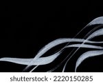 Small photo of This is a background image with silver streamlines drawn with a brush on a black background