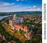 Small photo of Esztergom, Hungary - Aerial view of the Primatial Basilica of the Blessed Virgin Mary Assumed Into Heaven (Basilica of Esztergom) on a summer day with blue clouds and River Danube at background