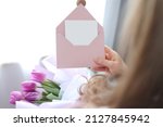 Woman Holding Envelope With...