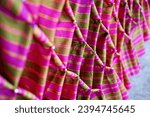 Small photo of Loincloth Catch pleated fabric tied for embellishing Art and technique of clothes bind down and pleating in ceremony place decoration handwork. Beautiful pattern crafts of original fabric in the Thai.