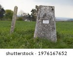 Small photo of Ordnance Survey marker at Milton Abbas, Dorset. Dated 1999, this is a marker for the GPS network and is an offence to damage it.