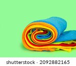 Small photo of A set of multi-colored microfiber cloths for cleaning. Cleaning services. Cleaning of premises. A set of bright microfiber napkins for home cleaning.