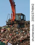 Small photo of Denpasar Bali, Sunday 5 July 2021, The activity of garbage dump on a garbage mountain in Serangan island and scavengers who collect garbage for recycling.