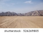 Desert On A Background Of...