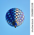 Blue air balloon flying in the clear blue sky. High quality photo