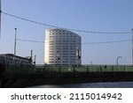Small photo of Limerick Ireland - 01 29 2022: Clayton (Clarion) Hotel Limerick city with Shannon bridge