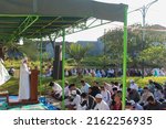 Small photo of Malang, Indonesia - May 2nd, 2022: Muslims are carrying out sermons for the Eid prayer outside the mosque