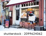 Small photo of Tallinn, Estonia - Dec 4, 2021: Popular Russian cuisine restaurant Troika on Town Hall square. Russian cafe during winter.