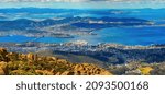 Small photo of Aerial panoramic view of Hobart City and its vicinity from the Mount Wellington peak. Tasmanian Island, Australia.