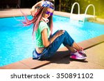 Close-up cool hipster girl with pink dreadlocks,wear floral cap big headphones,listens music enjoys holiday,colorful background,street fashion concept,casual punk outfit,music on earphones,tattoo girl