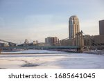 The Carlyle Building seen behind the Hennepin Avenue Bridge in Winter