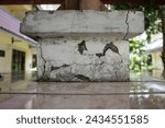 Small photo of cracks in building columns or perhaps plaster cracks