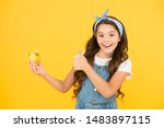 Homemade muffin. Bakery confectionery concept. Kid girl hold muffin. Gluten free recipe. Delicious cupcake. Little child with muffin on yellow background. Treat someone with sweets. Yummy cupcake.
