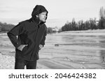 warm clothes for cold climate. weather forecast. human and nature. man walking snowy landscape in sunset. travel and expedition. man in red parka. winter male fashion. copy space. nice winter holiday