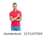 Small photo of handsome man with grizzled hair in red shirt isolated on white background. directing