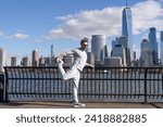 Small photo of Athlete stretching muscles and preparing for workout. Stretching routine of athlete outdoor. Athlete stretching his muscles after running. Athlete stretching to improve flexibility. Static stretch