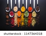 Spices and condiments for cooking on a black background