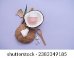 Small photo of Coconut pulp contains many antioxidants that help the skin become brighter and smoother. The unlabeled pink cream jar is placed inside half a fresh coconut. Mockups for advertising.