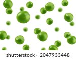 Falling green Pea, isolated on white background, selective focus
