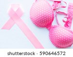 pink ribbon and bra on a white... | Shutterstock . vector #590646572