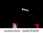 Small photo of Bandung, Indonesia - December 31, 2022: Binus campus logo (Bina Nusantara University) at night, West Java, Indonesia.