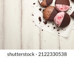 Small photo of American whoopie pie desserts on white wooden planks, copy space