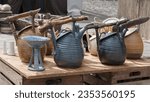 Small photo of Vessels, teapots in rustic style. Clay crafting, Earthenware, Ceramic art. Tough, practical, utilitarian ware for the kitchen. Art ware, tableware, decorative ware. Fair of pottery on the city square