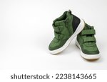 Demi-season men's shoes on a white background. Green men's boots
