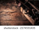 Small photo of craftsmanship concept illustrated by wooden box full of old rusty tools, gouge, hammer, screwdrivers, spirit level, pinces on workbench