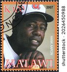 Small photo of Milan, Italy - July 27, 2021: Baseball player Hank Aaron on postage stamp