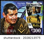 Small photo of Milan, Italy - July 27, 2021: Poster of Misfits, movie with Clark Gable, on stamp